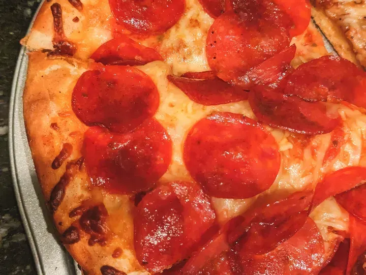 Pepperoni pizza with melted cheese topping.